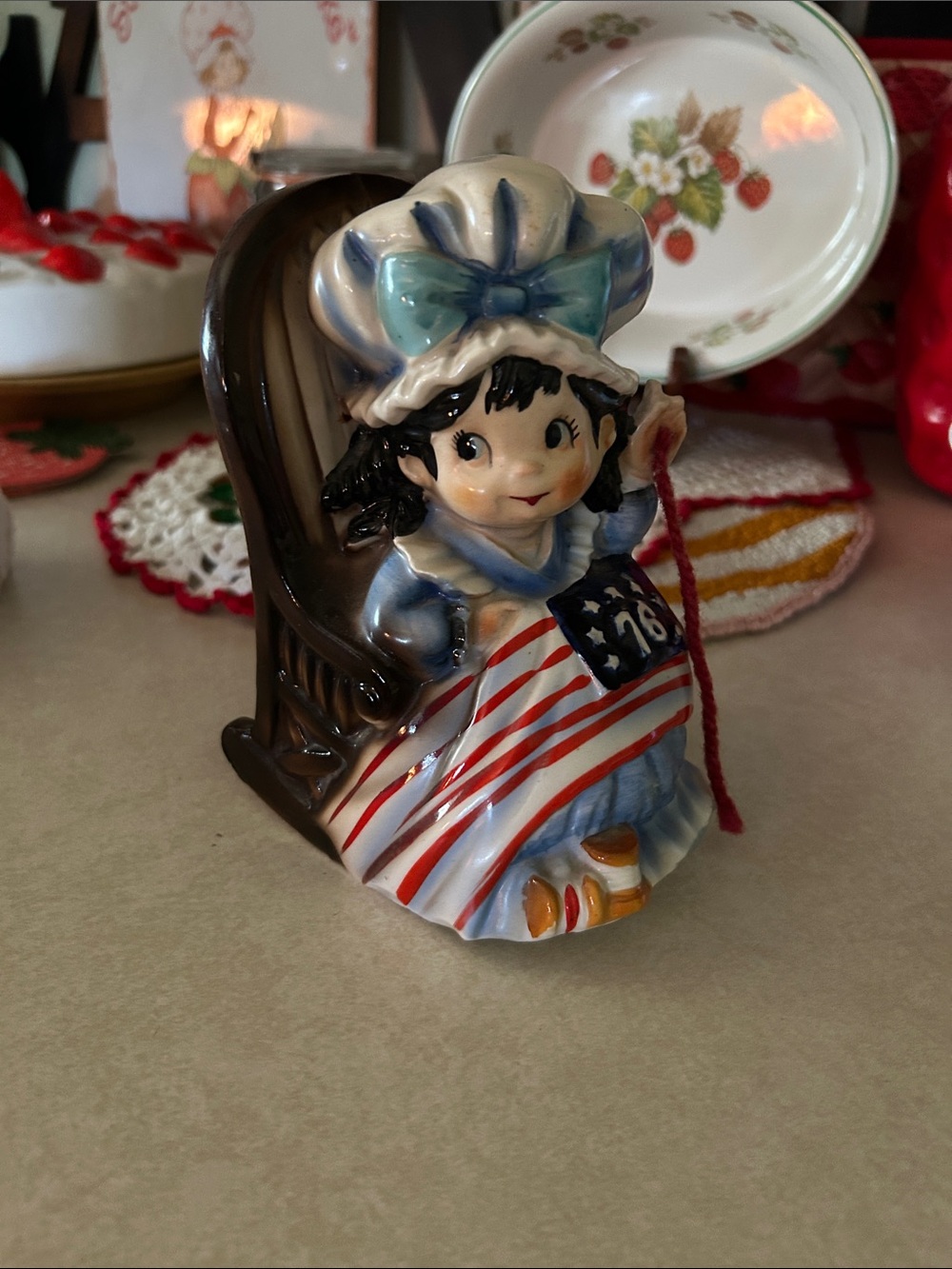 This is a vintage 1976 Betsy Ross music box figurine produced by the Fred Robert